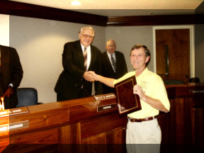 Hamfest Chairman receiving plaque of recognition from the Cleveland County Commissioners